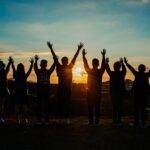 people silhouette during sunset